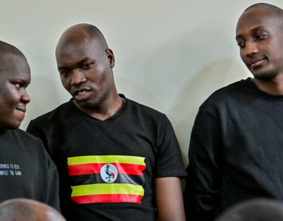 Baron Edgar, Bernard Ewalu and Thomas Kanzira in court. (Photo By Nicholas Bamulanzeki)